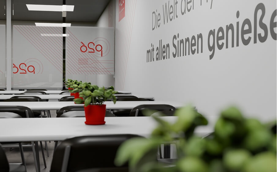 Innenansicht des P26 mit mehreren Tischinseln und Stühlen. Auf den Tischen stehen Pflanztöpfe mit frischen Kräutern.